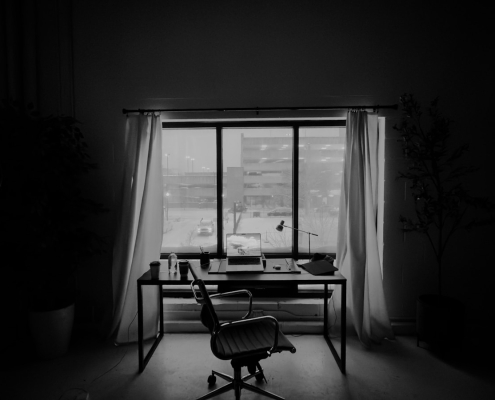 Empty creative agency desk by a window — where did all the good creatives go