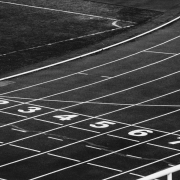 Black and white photo of the starting line on a running track